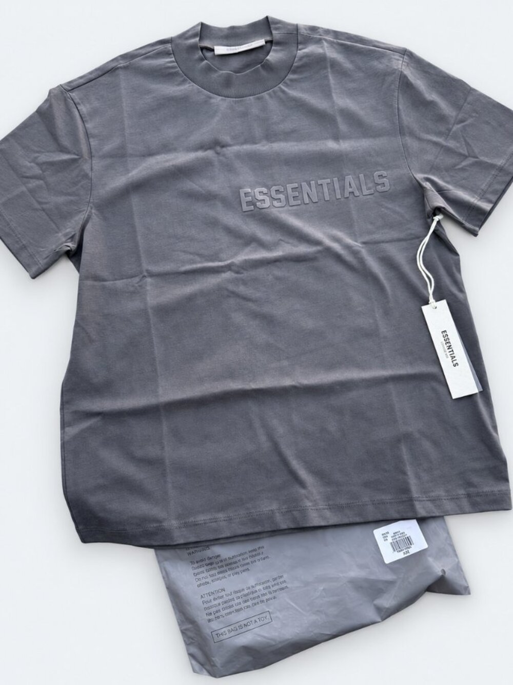 ESSENTIALS Logo Tee in Off Black